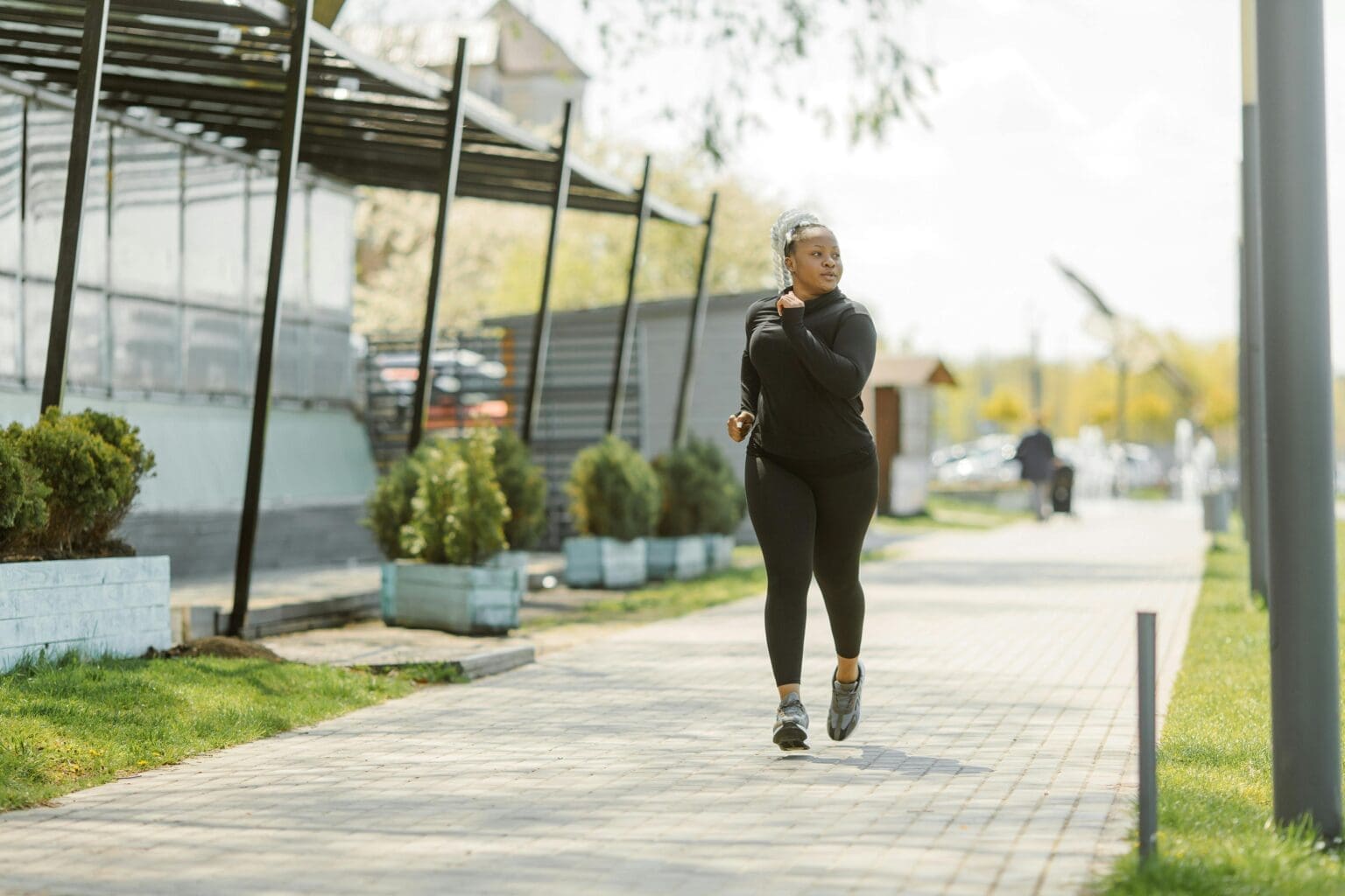 girl running on sidewalk
