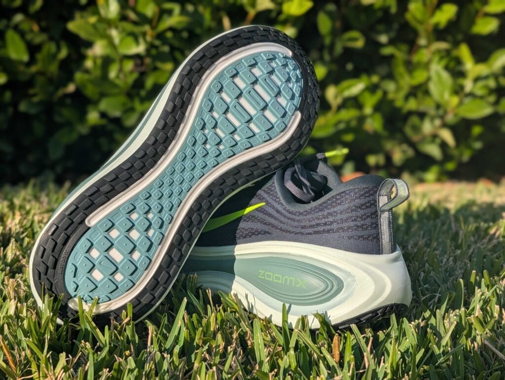 Nike Vomero Plus o Grass showing outsole