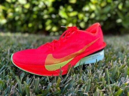 red nike vaporfly 4 shoes on grass