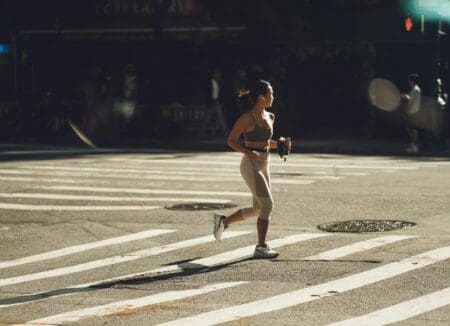 7 Best Stability Running Shoes (That Actually Feel Good to Run In) girl running in city