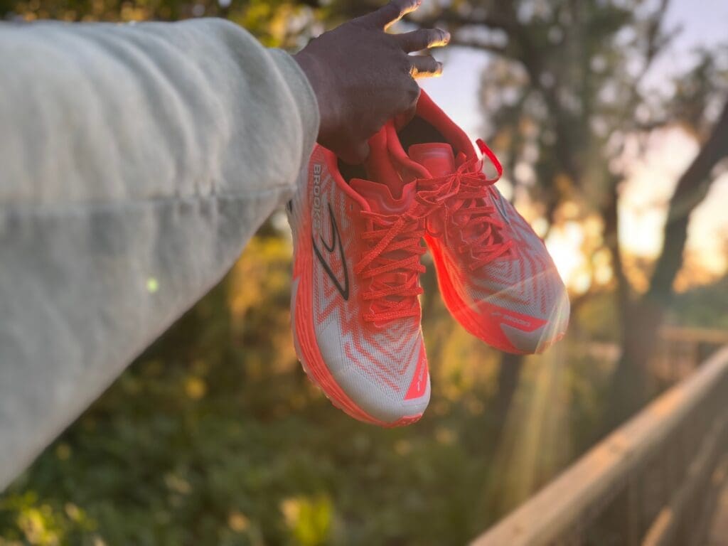 Brooks Catamount 4 With Sunbeam showing behind shoe during sunset on a trail