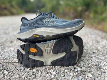 Topo Ultraventure 4 Review: Ditch the Bulky Hiking Boots Topo Ultraventure 4 stacked on top of each other on gravel trail