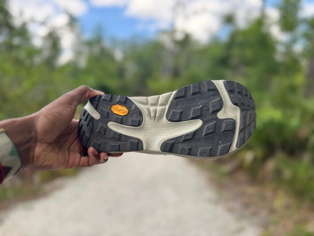 Topo Ultraventure 4 vibram outsole with gravel trail in the back
