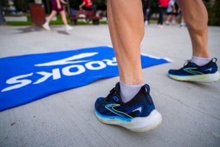 10 Best Brooks Running Shoes (2026): The Ultimate Buyer’s Guide brooks running shoes and brooks merch at race starting line
