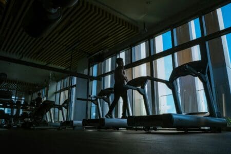 7 Best Treadmill Running Shoes of 2026 man running on treadmill inside nice gym