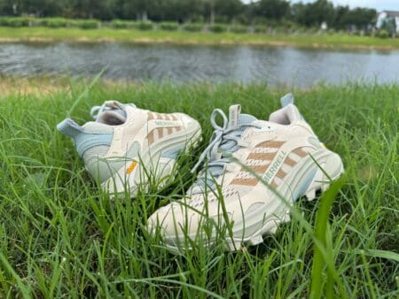 Merrell Moab Speed 2 in grass with pond in background