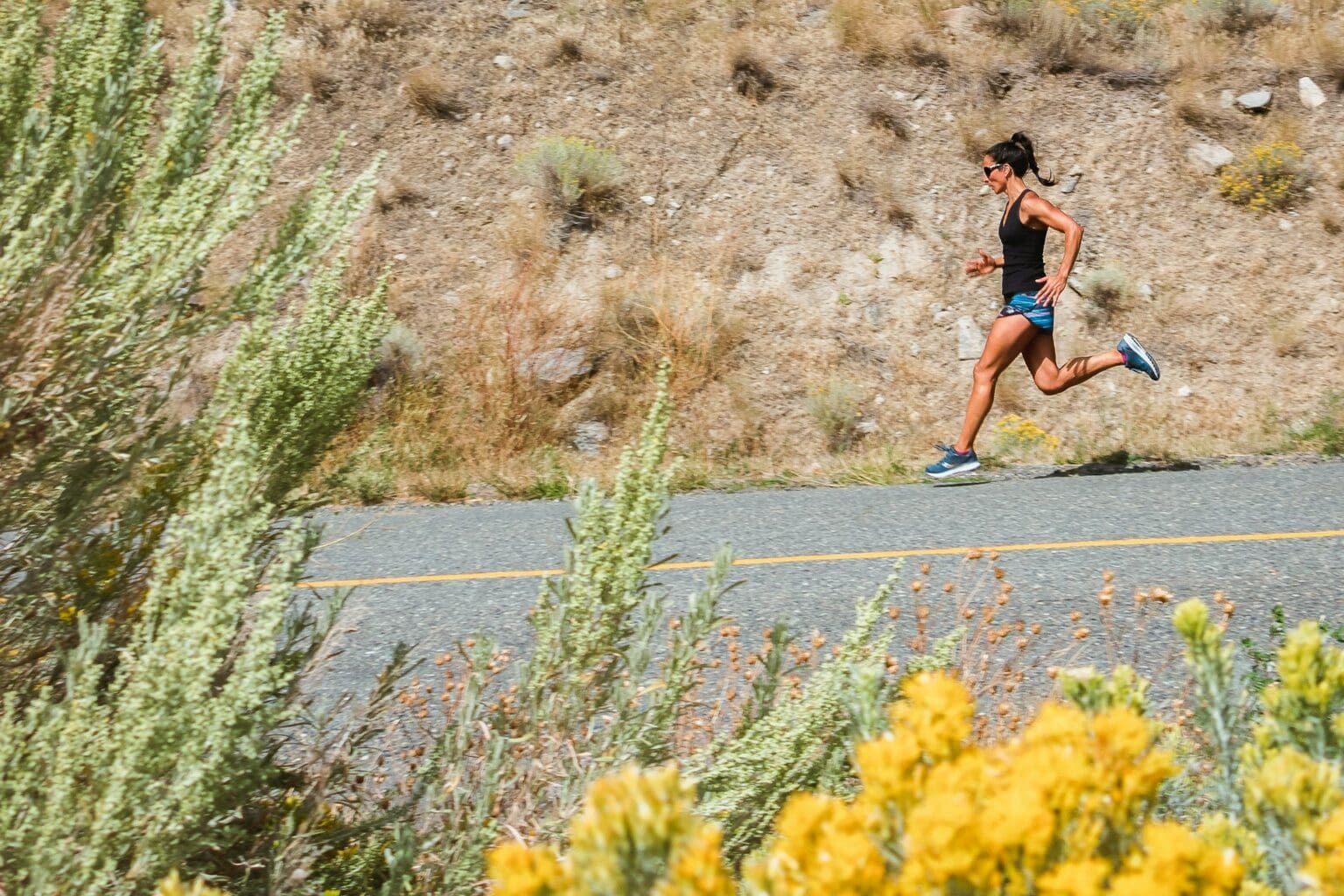 How to Build the Perfect Running Shoe Rotation: The 3-Shoe Rule person doing tempo run down hill