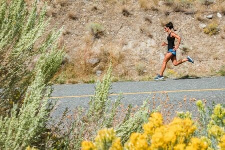 person doing tempo run down hill