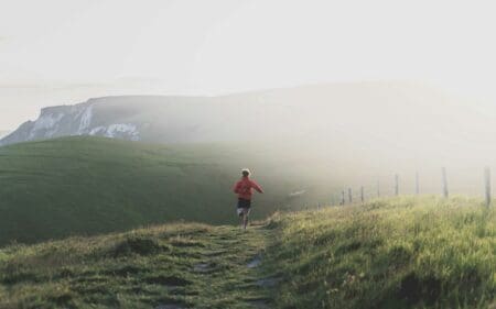 8 Best Budget Running Shoes of 2026: Genuine Budget Bangers person running on trail with budget running gear