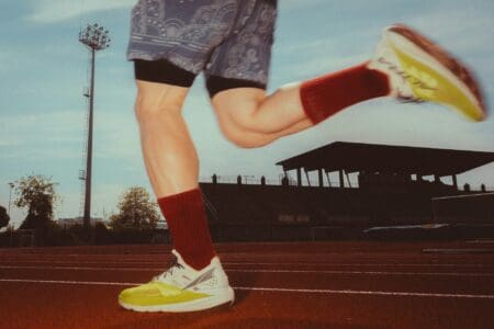 7 Best Zero Drop Running Shoes (2026): Find Your Natural Stride man running wearing altra zero drop running shoes on a track
