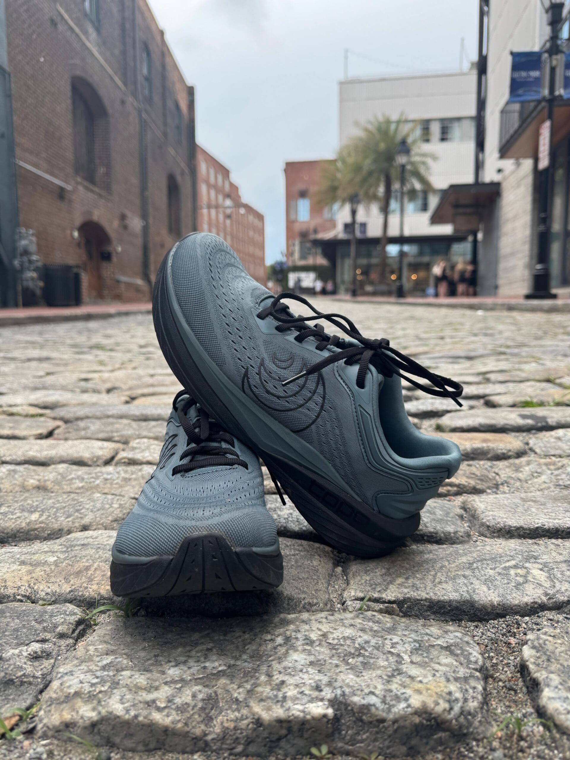 Topo Athletic Phantom 4 riverstreet bricks undereneath with city in background