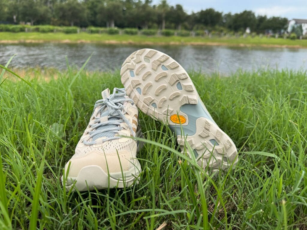 Merrell Moab Speed 2 in grass showing vibram outsole