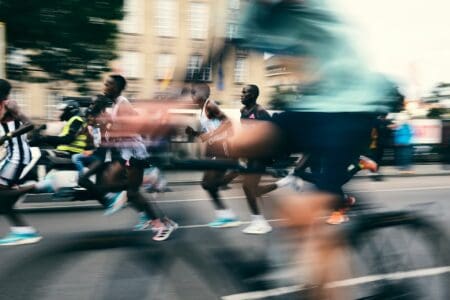 elite racers wearing carbon plated running shoes