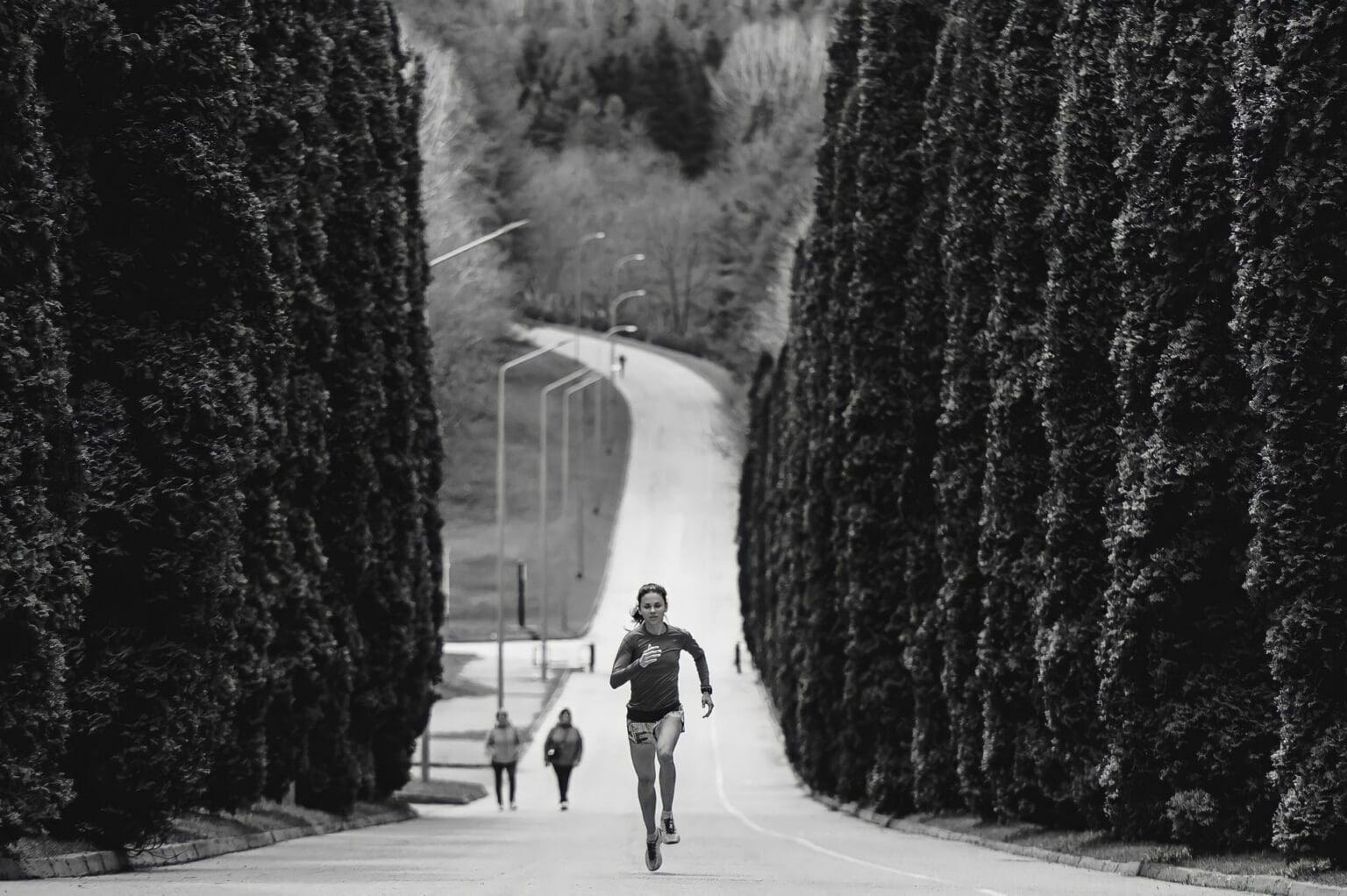 Stability vs. Neutral Running Shoes: Which Do You Need? person running uphill in neutral running shoes