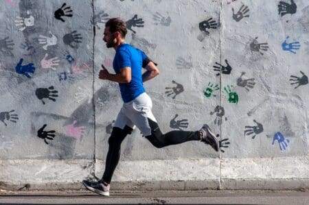 person running efficiently and breathing well