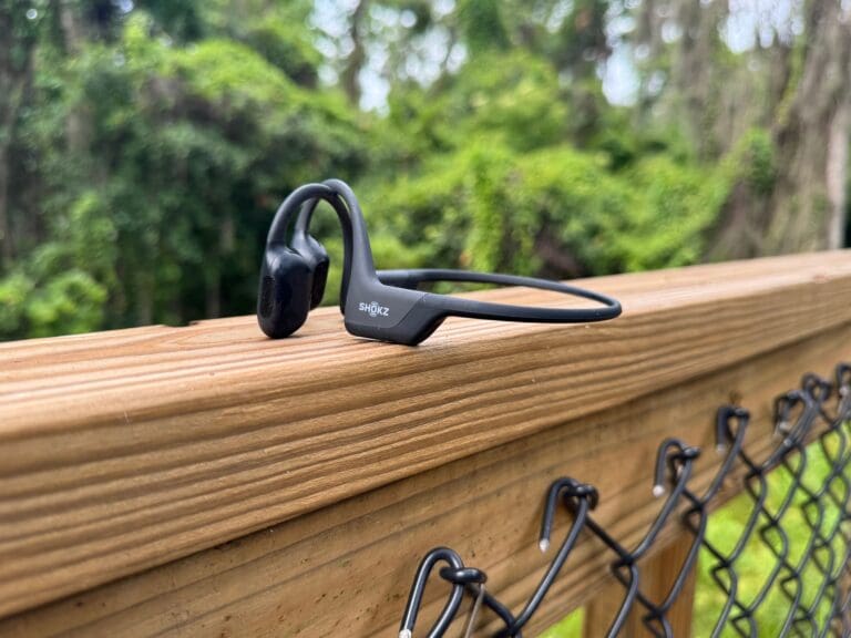 shokz open run pro on trail ledge