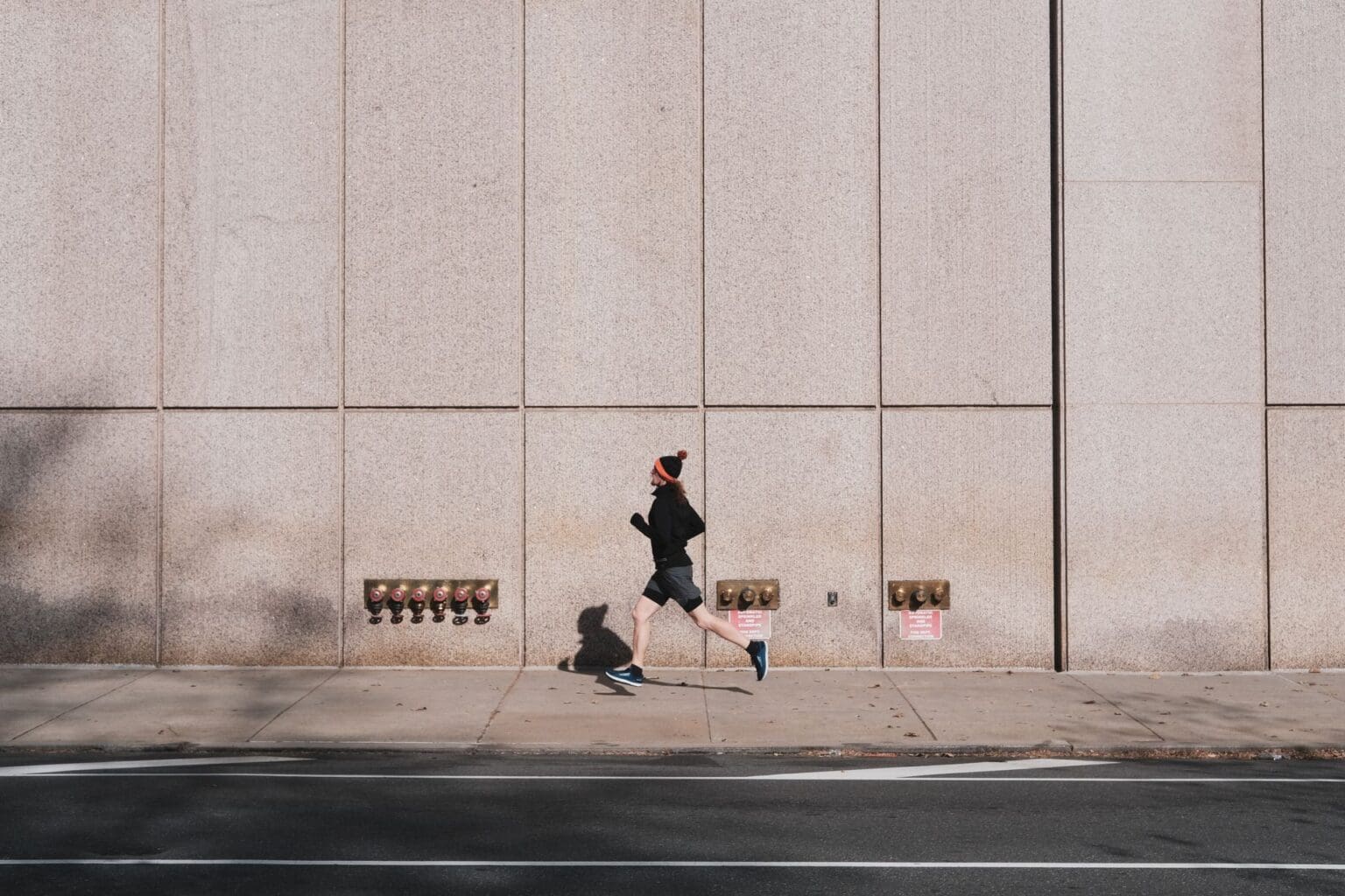 Walking Shoes vs. Running Shoes: What’s the Difference? person running through city
