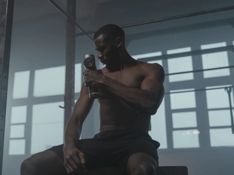 man using massage gun