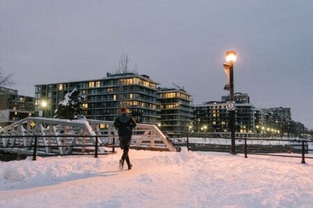 How to Run in Cold Weather: Tips to Stay Warm & Safe man running in freezing cold weather in the snow